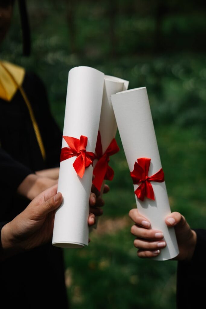 People Holding Diplomas